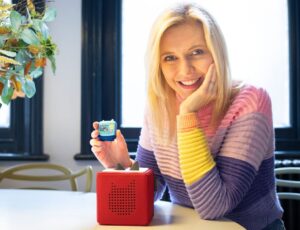 Countdown presenter Rachel Riley holding a Maths Magic Clever Pocket Tonie