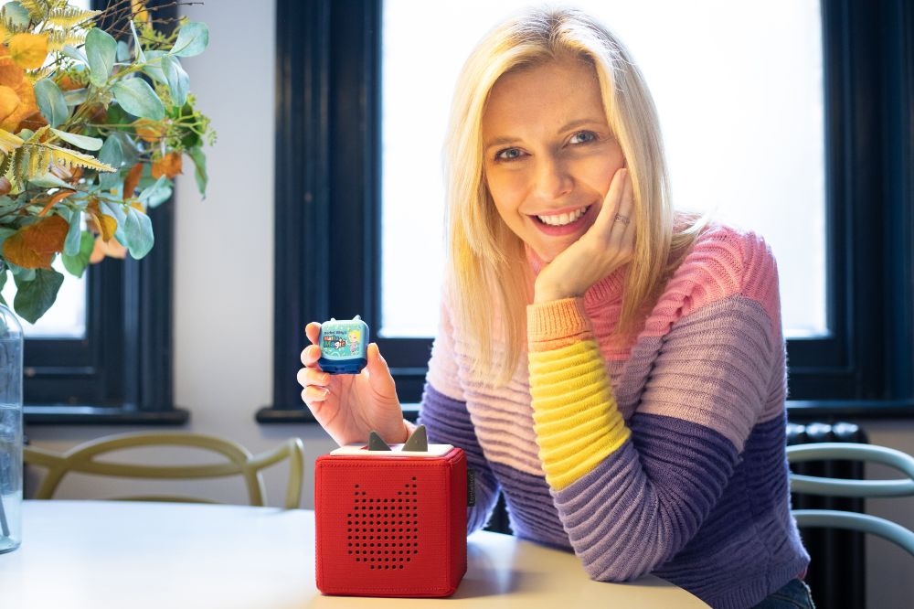 Countdown presenter Rachel Riley holding a Maths Magic Clever Pocket Tonie