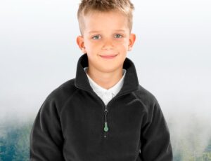 A boy in a black school fleece from the RESULT® Genuine Recycled range