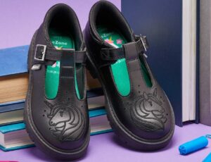 A pair of ToeZone black school shoes with unicorns embossed on the front