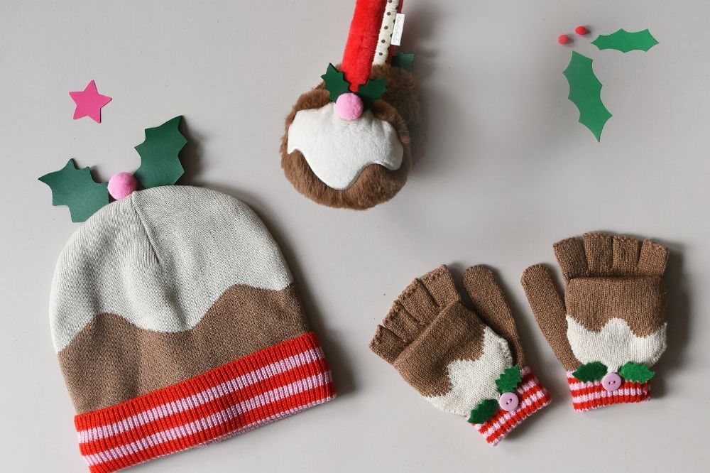 A child's Christmas pudding hat, fingerless gloves and earmuffs by Rockahula Kids