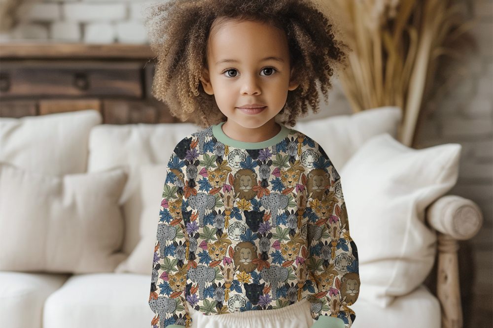 A child wearing a top with animals on from the Charley's Wild World collection, winner of #SBS Small Business Sunday