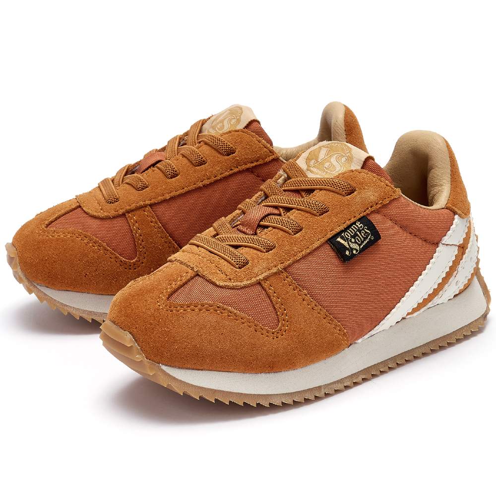 A pair of children's tan sneakers by Young Soles