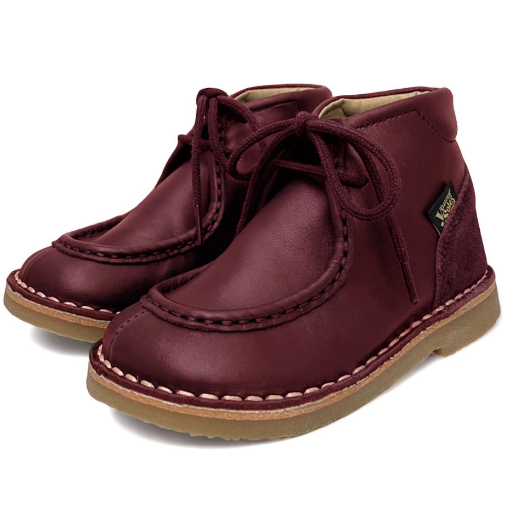 A pair of children's burgundy boots by Young Soles