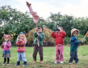 A group of children stood outside in a garden