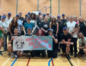 The Maped team in a sports hall celebrating the Maped Helix Great British Sports Day