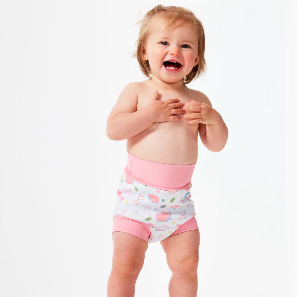 A young girl laughing wearing a swim nappy by Splash About 