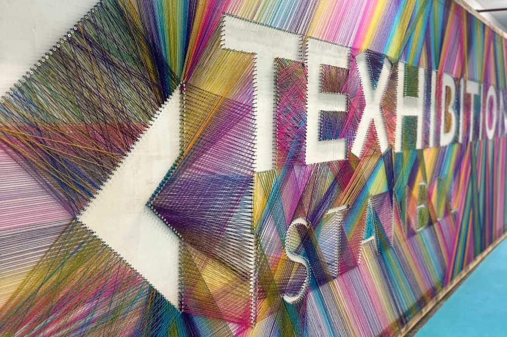 Texhibition Istanbul sign made out of different coloured yarns