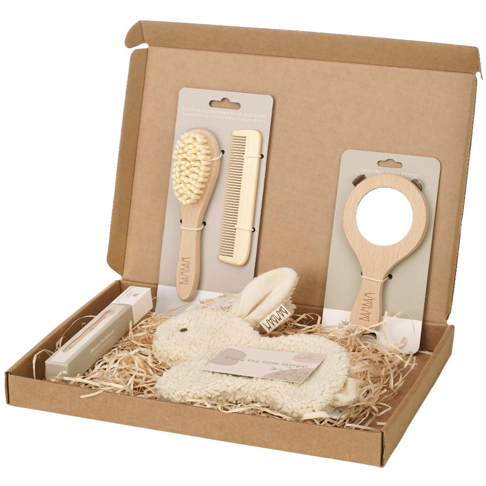 A cardboard giftbox containing baby accessories 