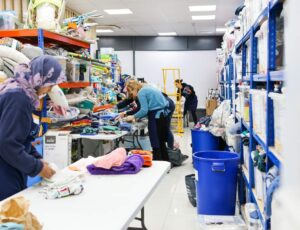 Volunteers packaging goods for the Baby Bank Alliance