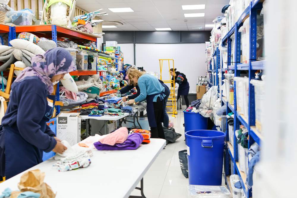 Volunteers packaging goods for the Baby Bank Alliance