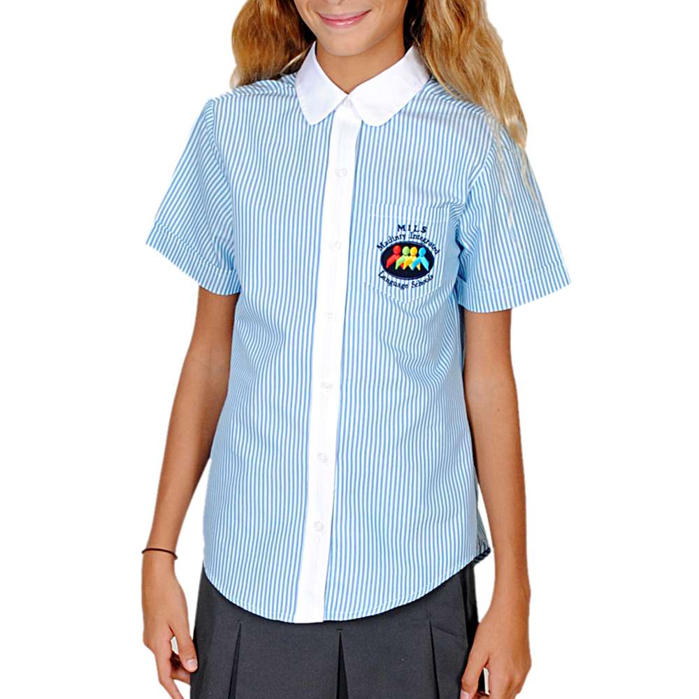 A girl in a blue and white striped school shirt and grey skirt 