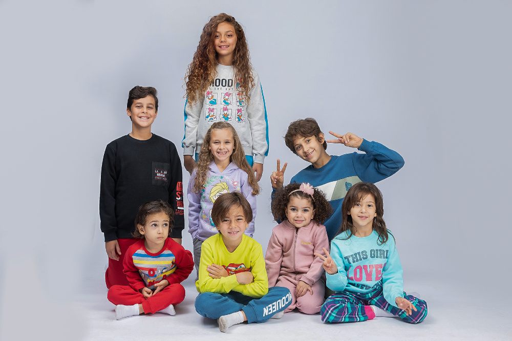 A group of children wearing clothing made by an Egyptian manufacturer