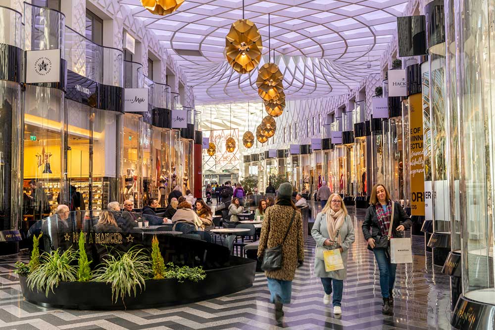 People walking through Victoria Gate Leeds