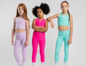 Three girls stood together wearing Bonini activewear