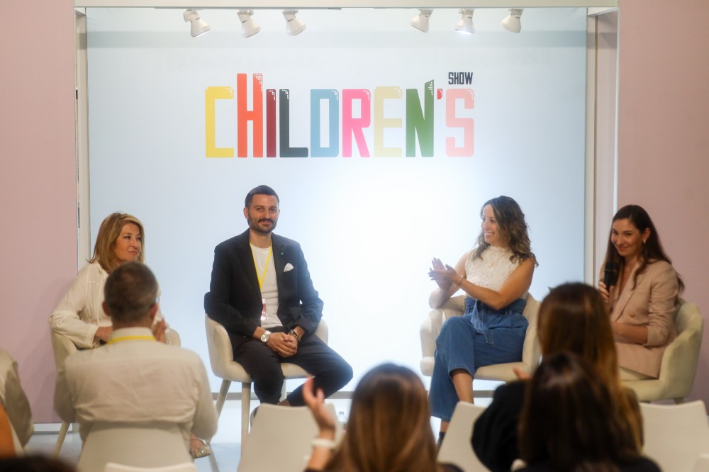 People sat on a stage talking at Children's Show NYC