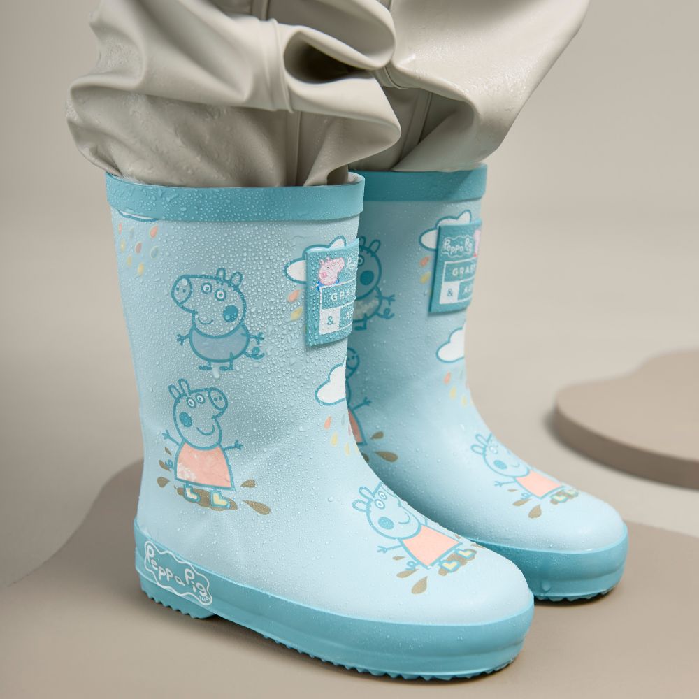 A pair of pale blue children's wellies featuring a Peppa Pig print 