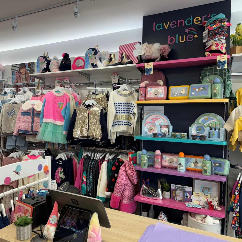 Children's clothes and accessories displayed inside the Lavender's Blue store