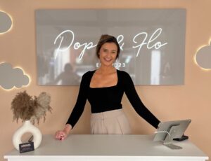 A woman stood at a counter inside the Pops & Flo children's store