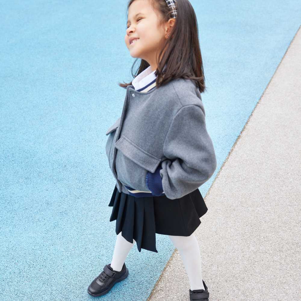 A young girl in school uniform 