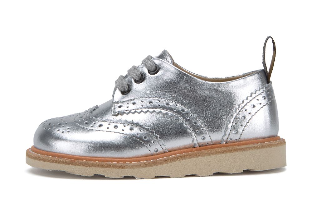 Side profile of a child's silver brogue shoe 