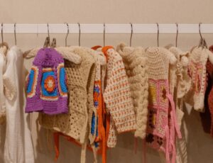 A rail of children's crochet clothing items