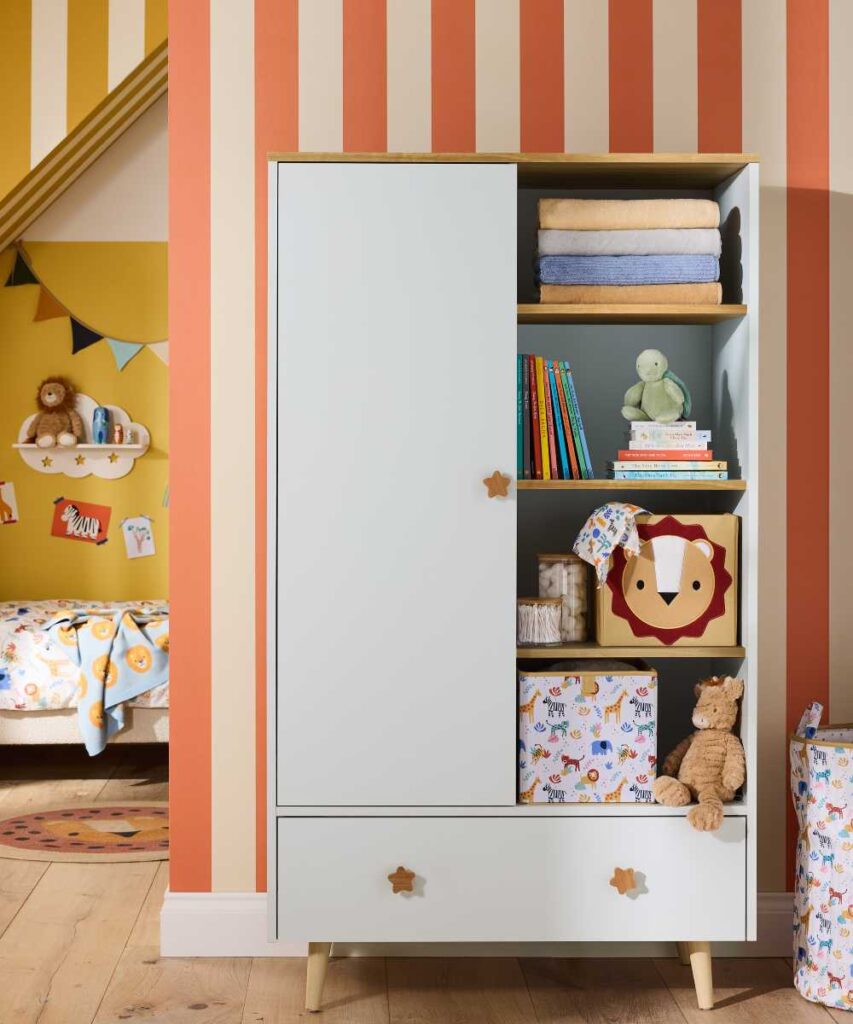 An open cupboard in a child's room showing accessories and toys 
