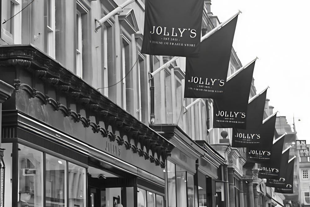 A back and white picture of the Jollys Department store front