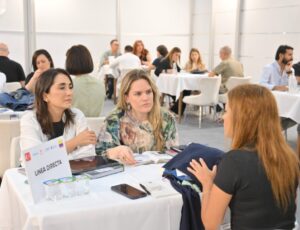 People sat at a table looking at fabrics at Texhibition Istanbul