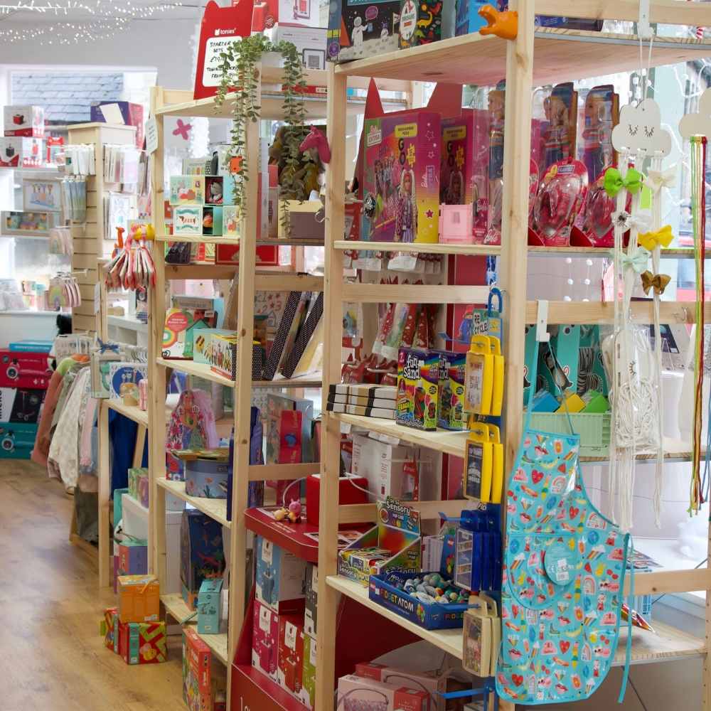 Shelving in the Noughts & Crosses store displaying children's product 