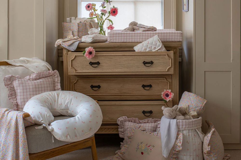 A child's nursery featuring baby accessories and decor from the Wild Garden Collection by Avery Row