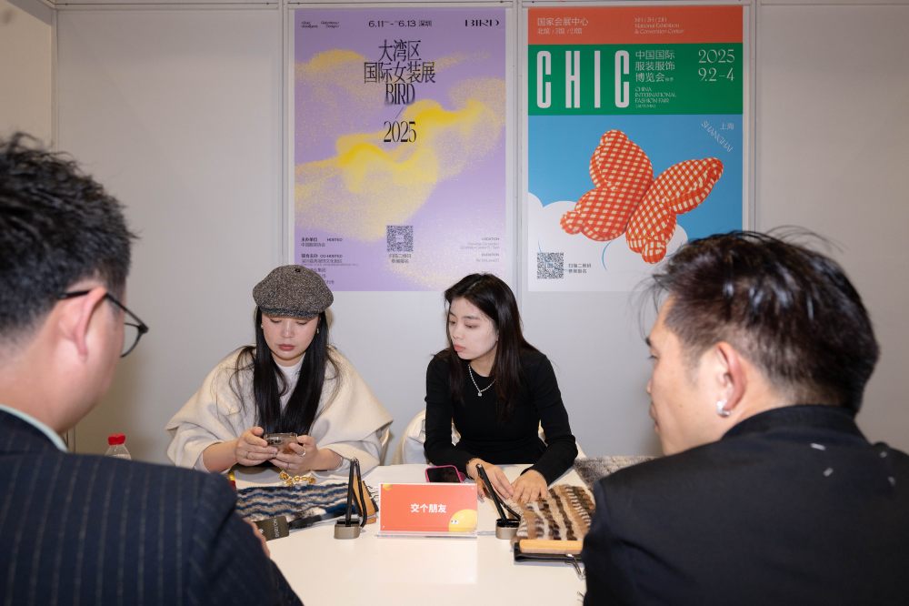 Four people having a meeting at the CHIC trade fair 