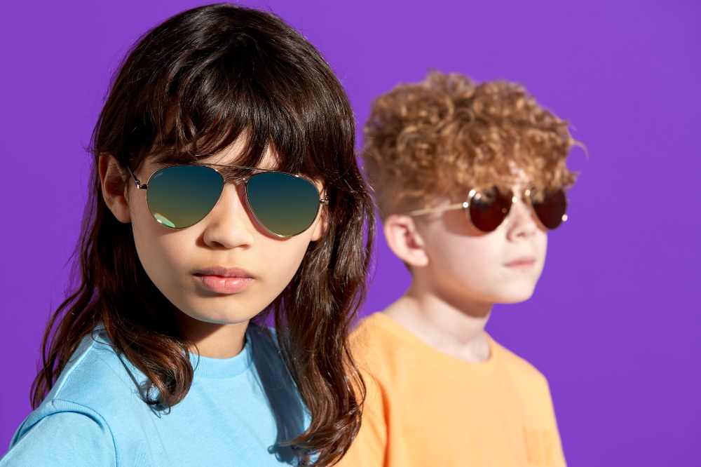 A girl and boy wearing sunglasses