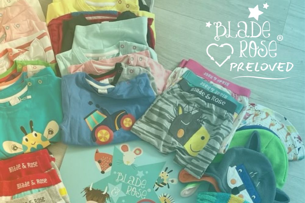 Items of Blade & Rose children's clothing folded up on the floor beside a Blade & Rose Preloved logo