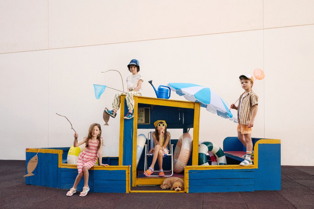 A group of children on a blue boat