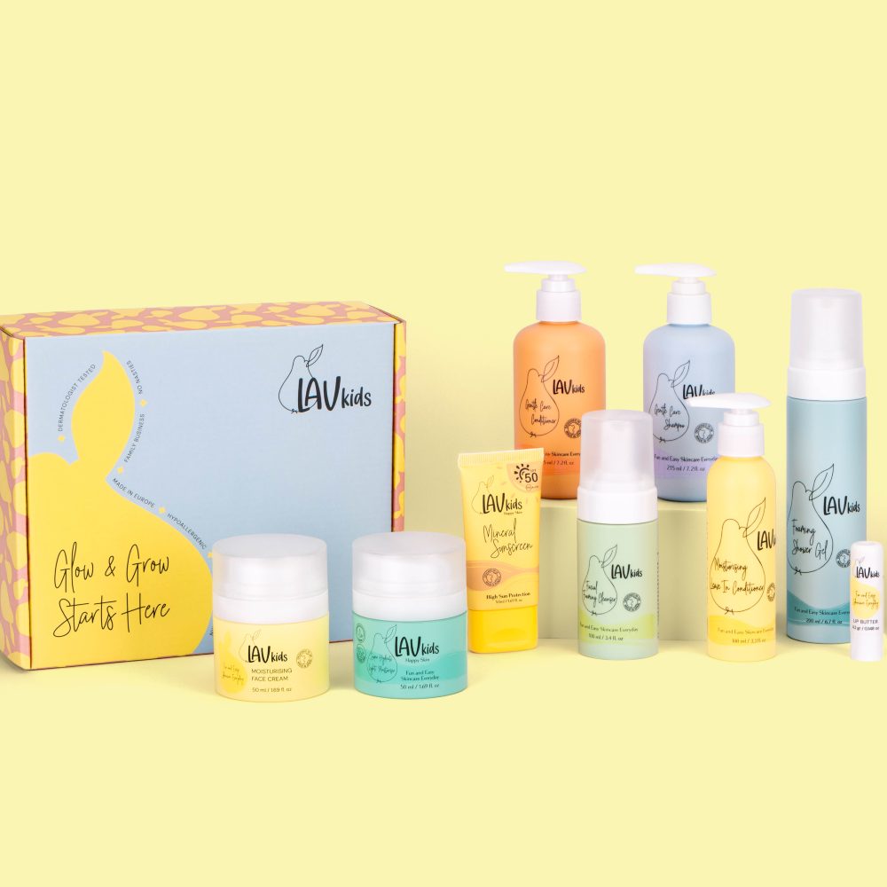 A selection of children's toiletries displayed against a yellow background 