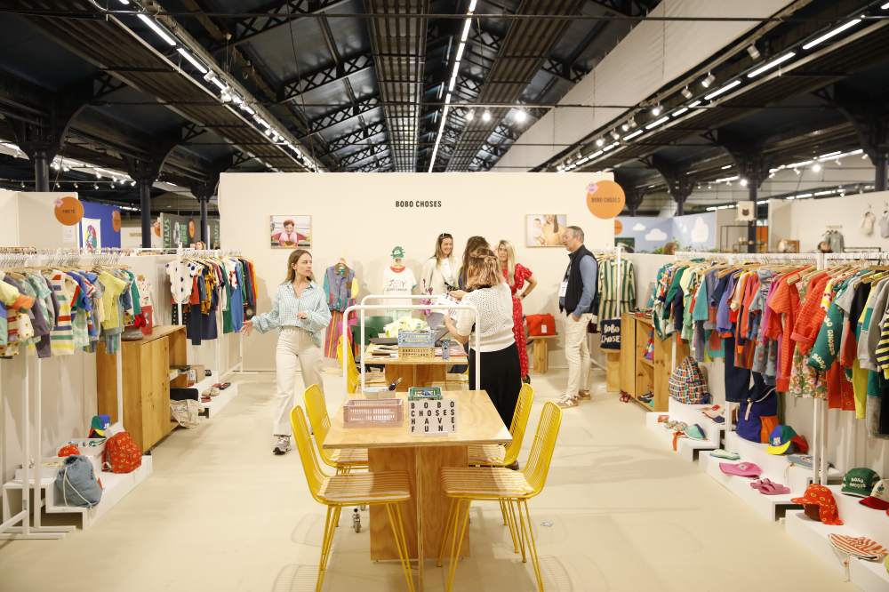 People stood on a stand at the Playtime Paris trade show
