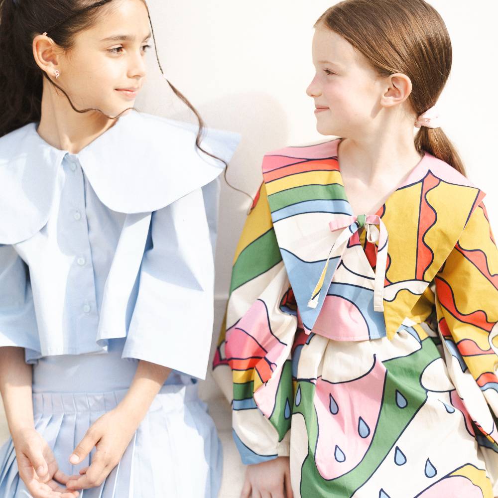 Two girls in elaborate dresses 