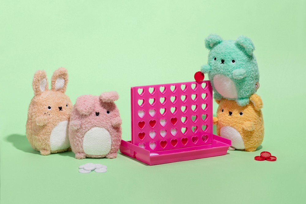 Four mini sitting plush toys by Noodoll displayed playing a game