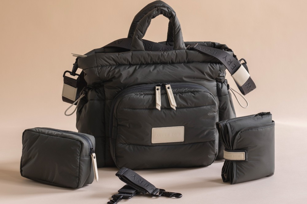 A black Avery Row changing tote bag