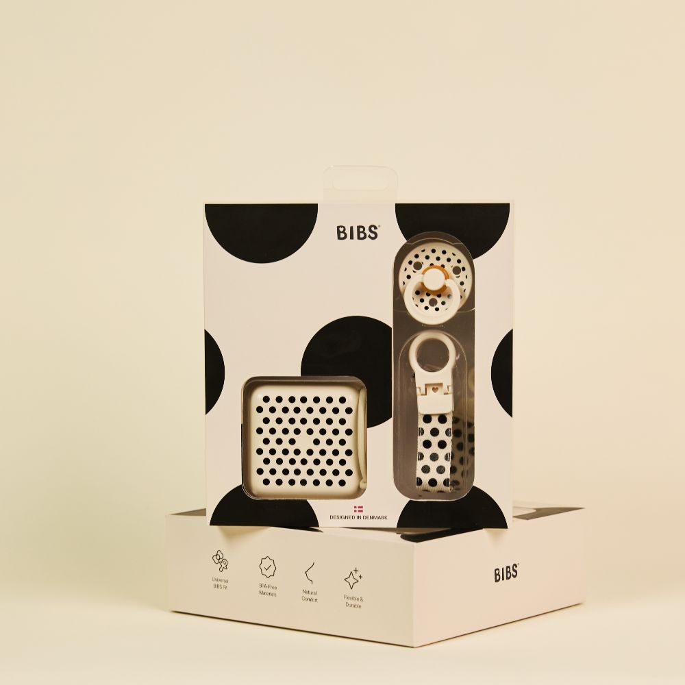 A polka dot gift set by BIBS containing a pacifier and accessories