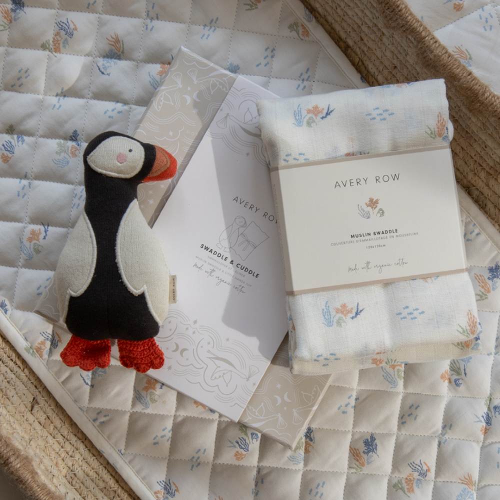 A child's puffin toy and swaddle blanket gift set 