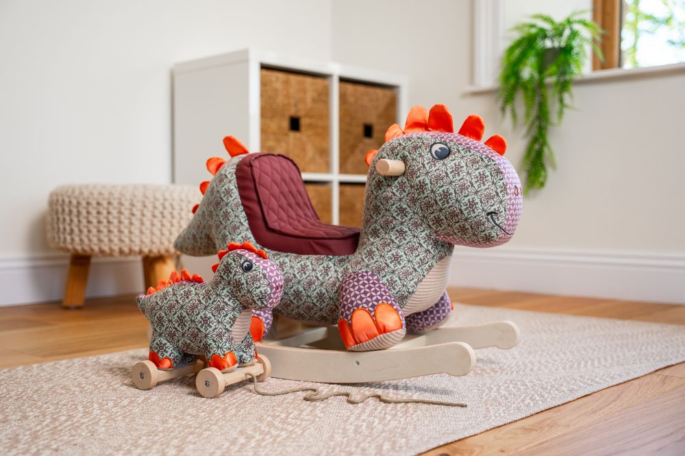 A dinosaur ride-on toy and pull-along toy by The Little Bird Told Me 