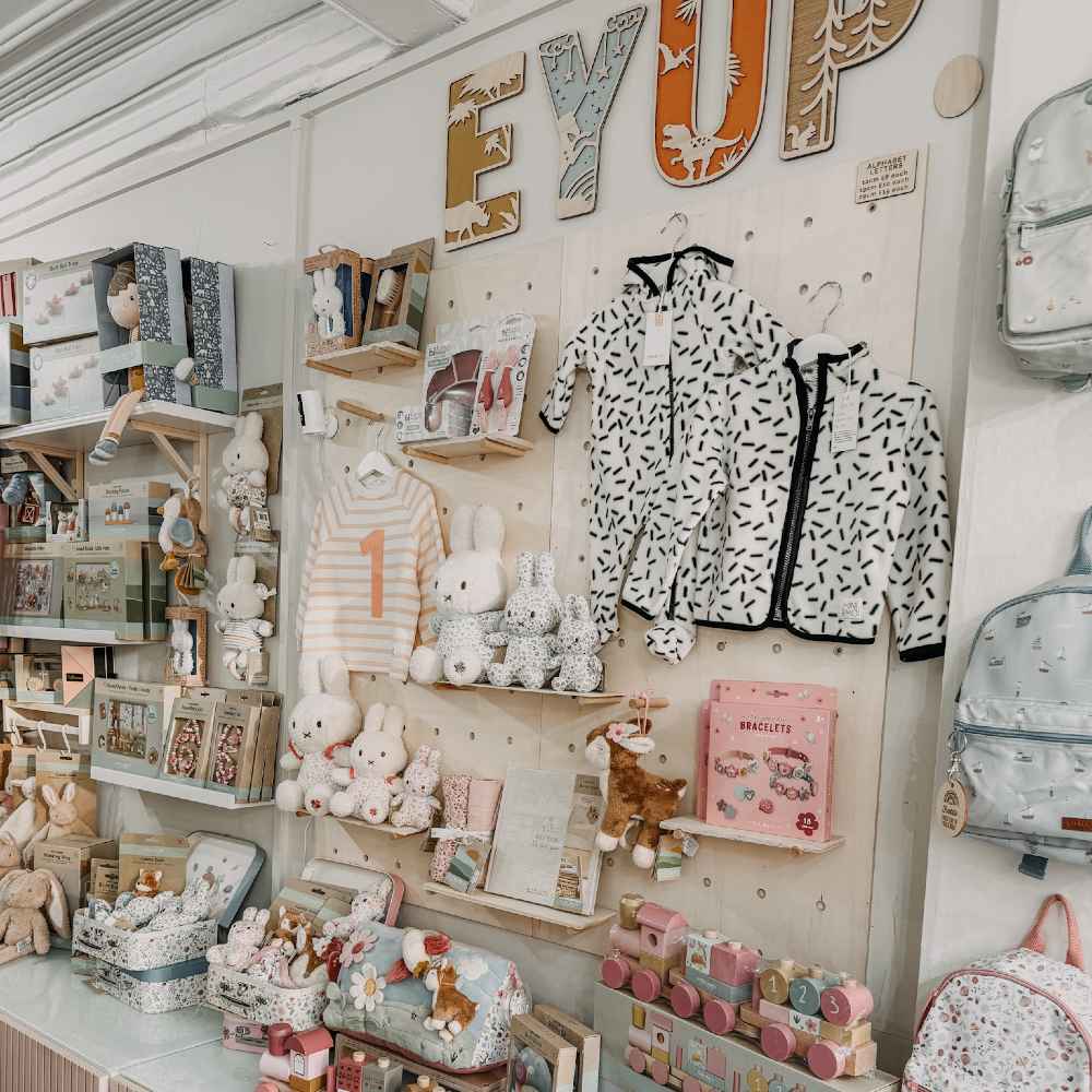 Children's clothing, accessories and gifts displayed in a shop