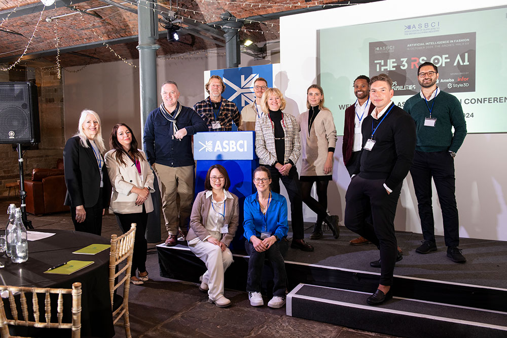 A group of speakers stood together on stage