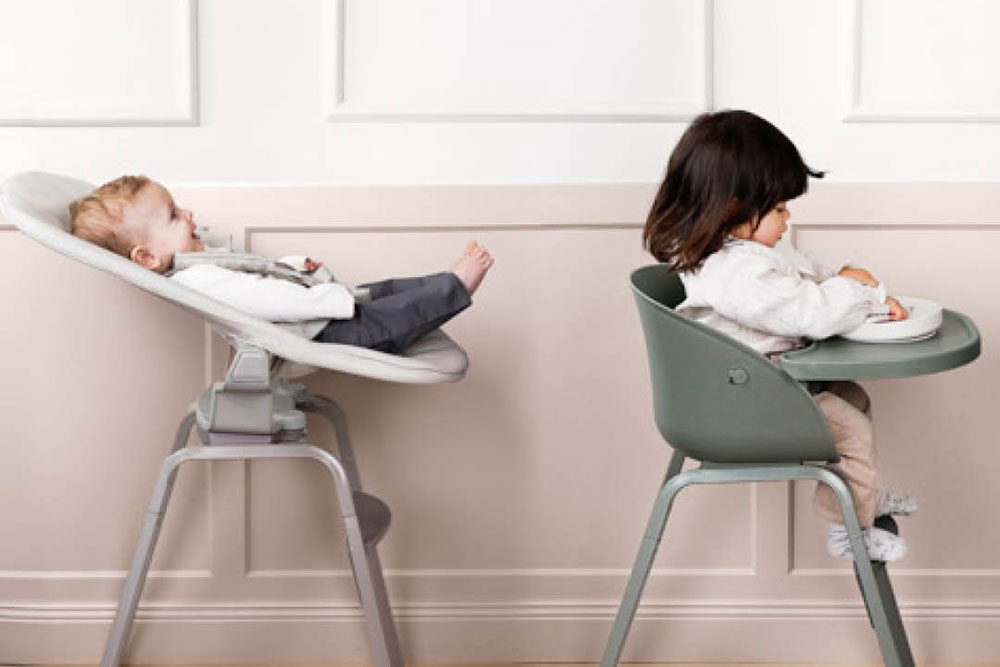 Two young children sat in the Grace Convertible High Chair