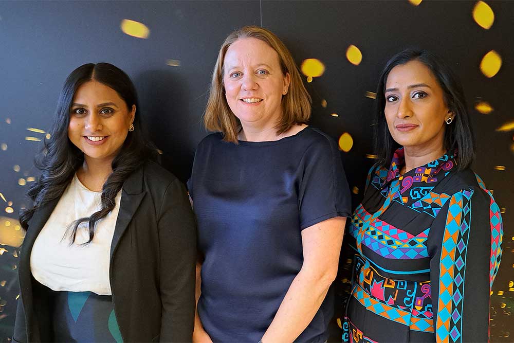 Three members of the Playroom Supplier Meet and Greet Team stood together