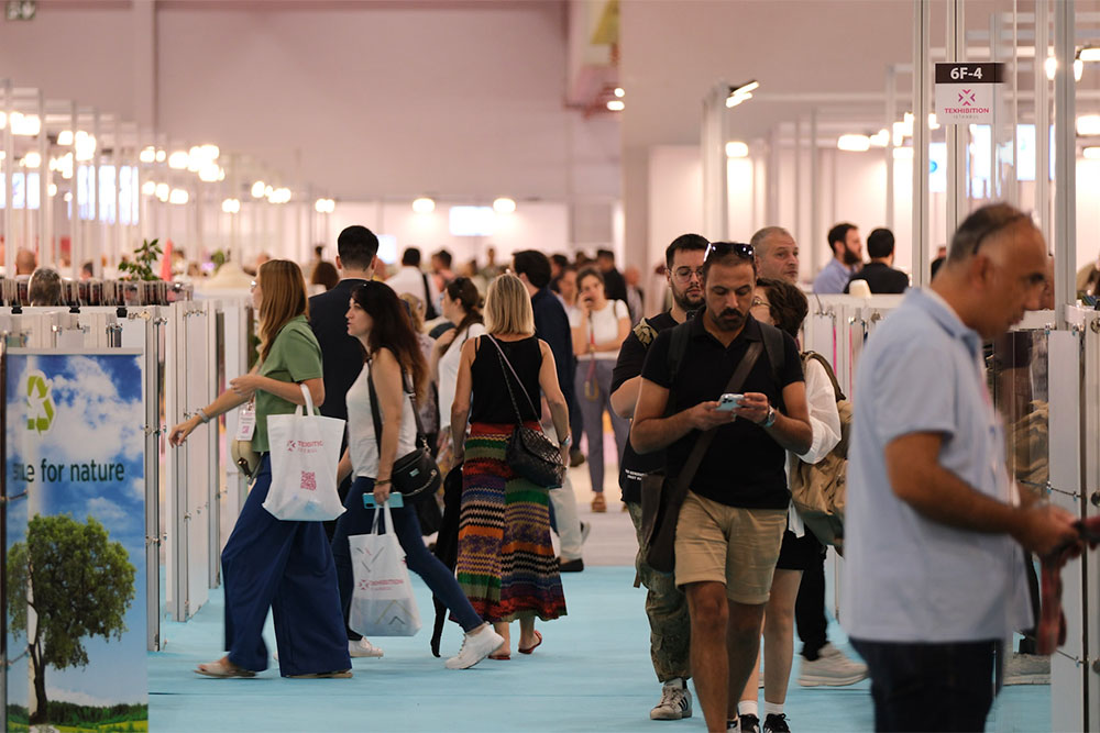 Texhibition Fair full of visitors looking round the exhibition stands