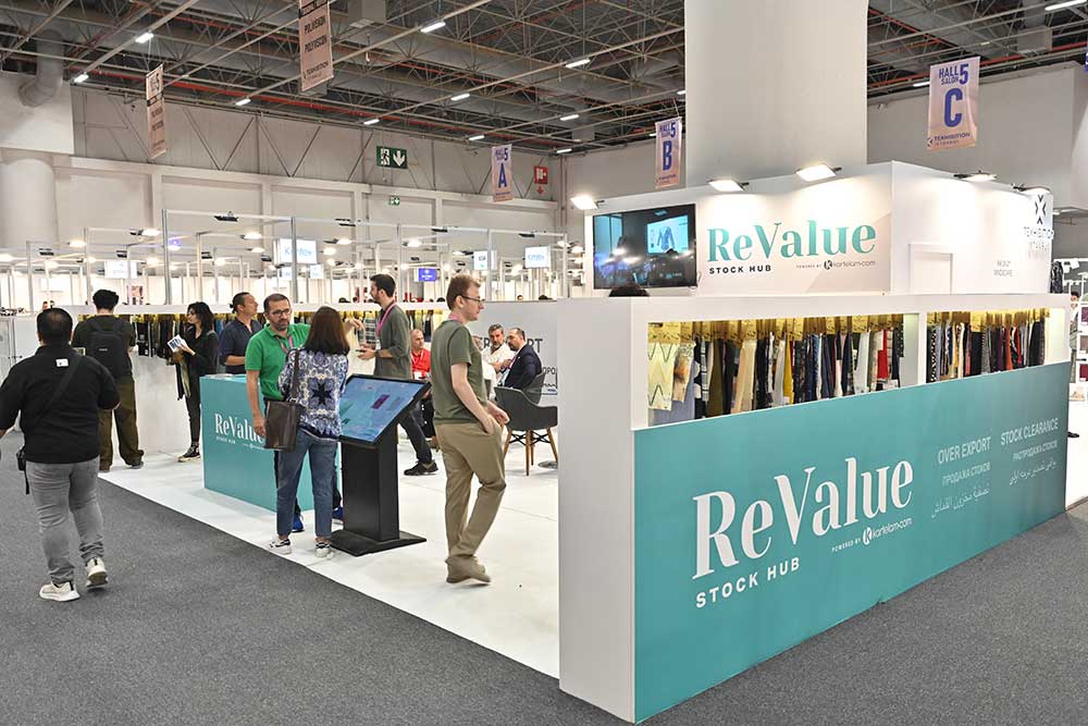 A busy stand full of visitors speaking with exhibitors at Texhibition Istanbul