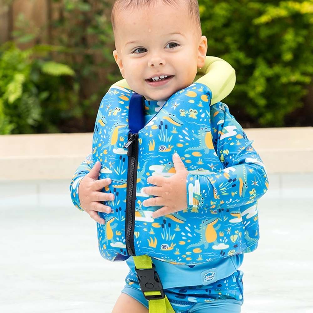 A young boy outside in a pool wearing the new Early Years Swim Vest by Splash About 
